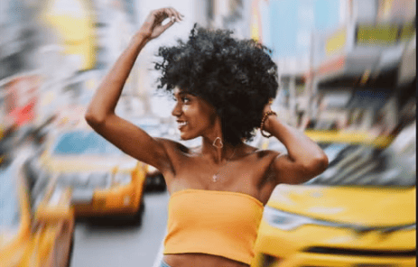 a blurred background to focus on a lady in the photo