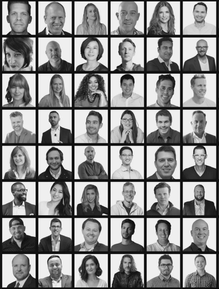 A grid of 48 black and white headshots showing diverse men and women, each facing the camera and smiling or maintaining a neutral expression against plain backgrounds.